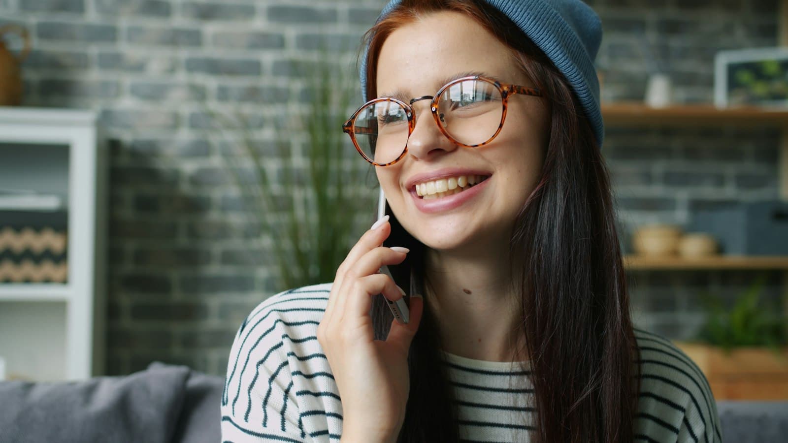 A young woman talking on her phone